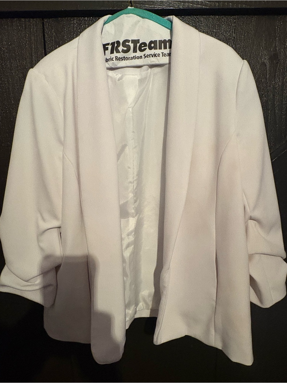 White blazer with ruffled sleeves